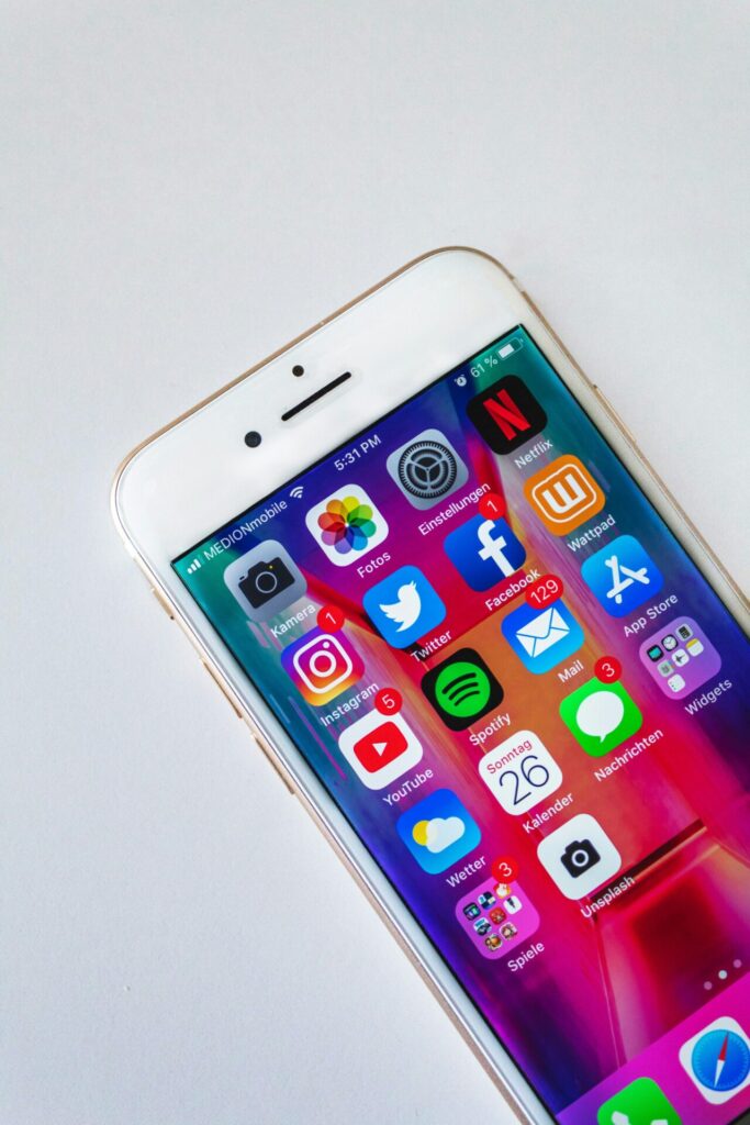 image of an iPhone with social media apps | marketing without social media posting